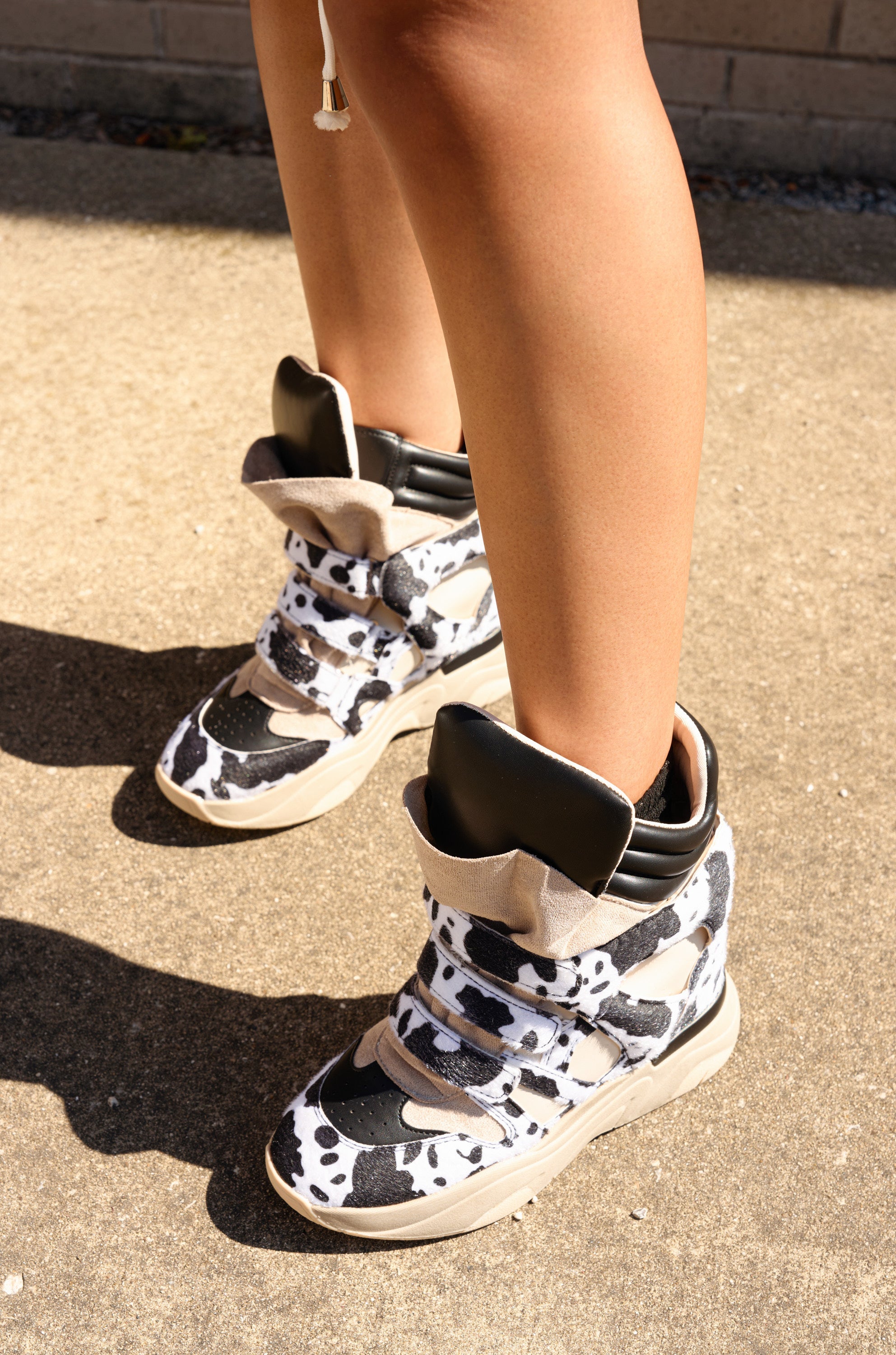MARANTO BLACK COW PRINT WEDGE SNEAKER