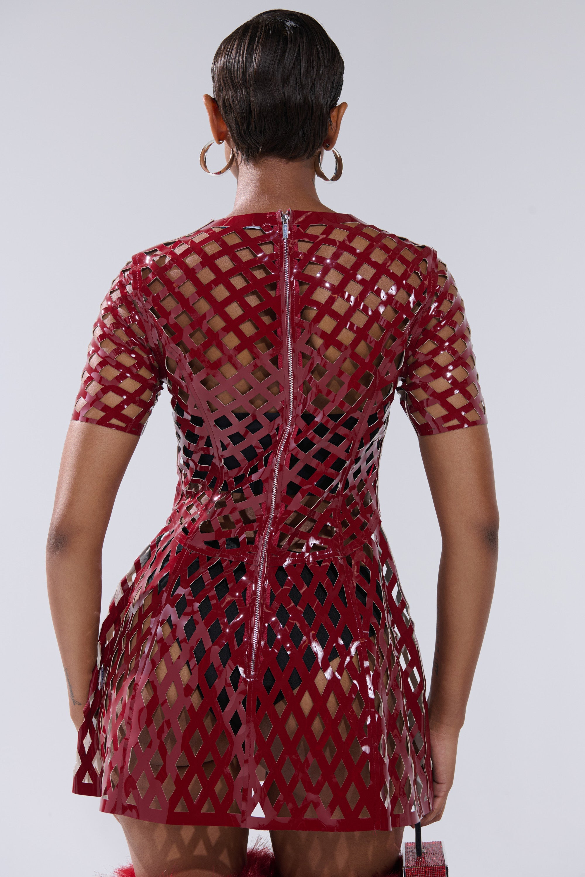 SHE'S DIFFERENT CUT OUT FAUX LEATHER MINI DRESS IN BURGUNDY