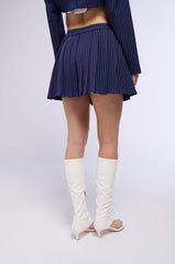 WHATS THE TEA PINSTRIPE PLEATED MINI SKIRT IN NAVY